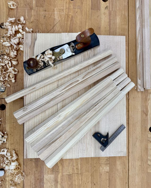 Chair components laid out on a workbench